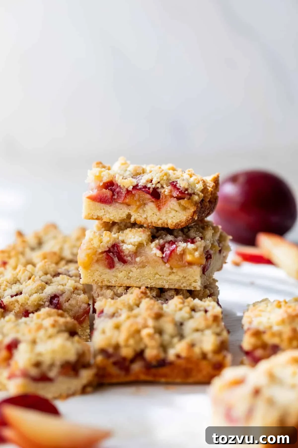 a stack of plum crumb bars.