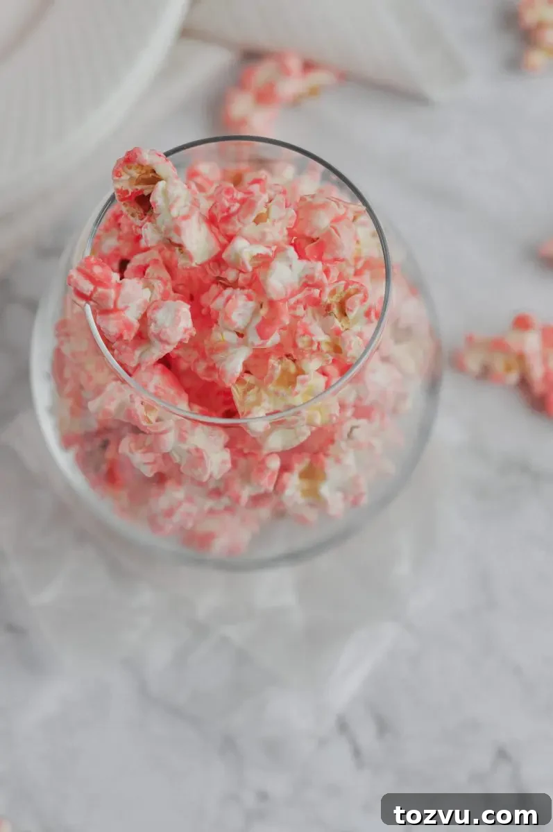 How to Make Pink Strawberry Popcorn 3 A glass full of pink popcorn