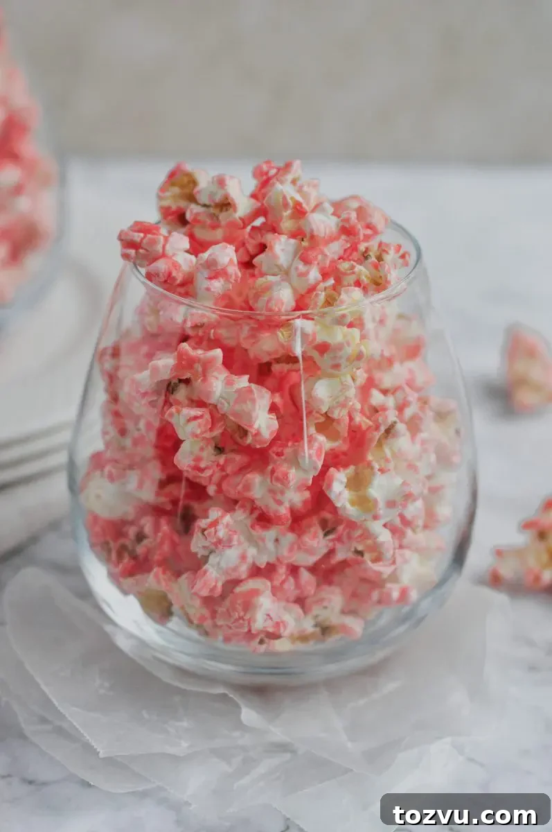 How to Make Pink Strawberry Popcorn 5 a glass full of pink popcorn