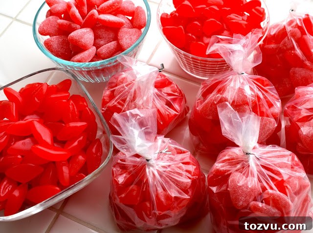 Valentine's Day Treat Bags: How to Buy in Bulk 4 Preparing treat bags with ribbon