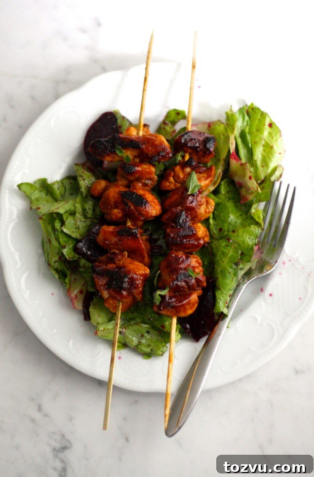 Stovetop Sambal Chicken Skewers Served on Fresh Greens 4 Sambal Chicken Skewers