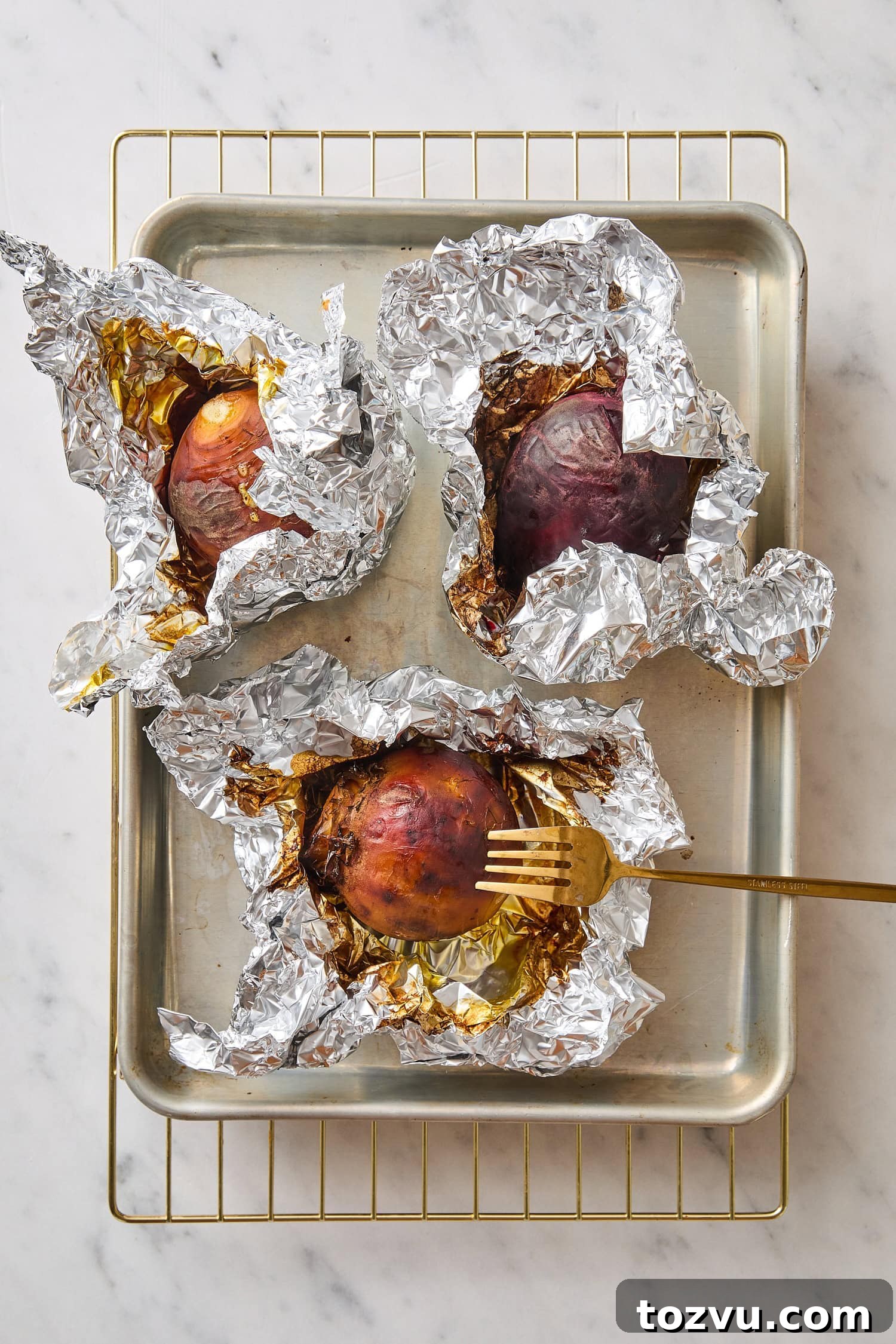 Grilled Steak with Roasted Beet and Goat Cheese Salad 8 Roasted beets after being roasted in tin foil.