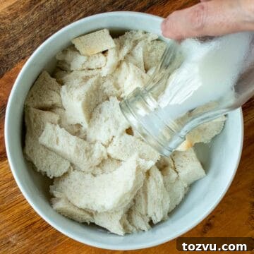 Crispy Fried Meatballs with Garlic Dipping Sauce 4 Milk being pour from a bottle onto white bread.