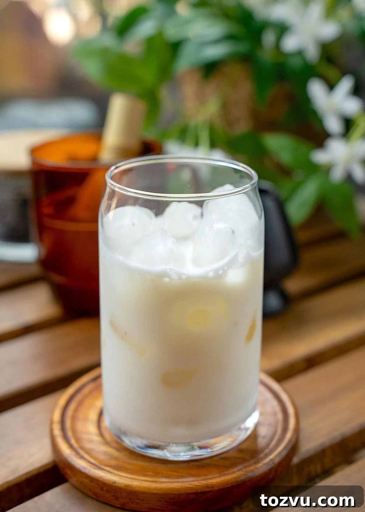Creamy Banana Matcha Latte Recipe 9 remaining half of milk added to blended mixture in a glass