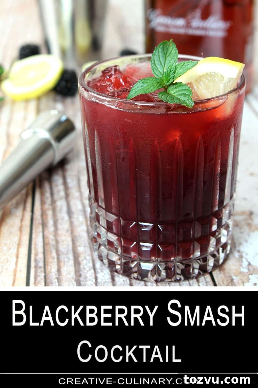 Pin for Blackberry Smash Cocktail made with blackberries, whiskey, and mint in a cut crystal low ball glass.
