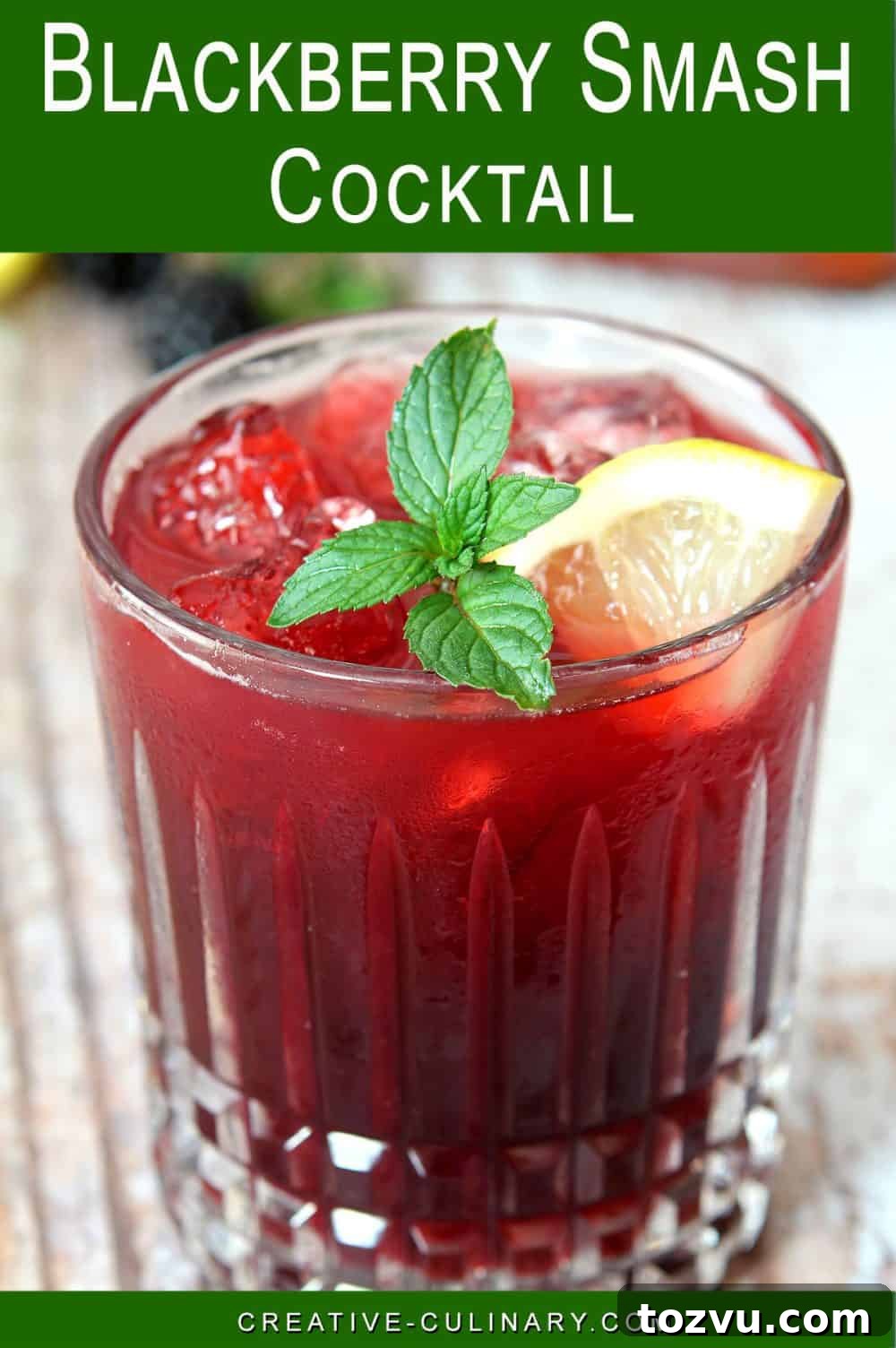 Pin for Closeup of Blackberry Smash Cocktail made with blackberries and whiskey, garnished with mint and lemon slice.