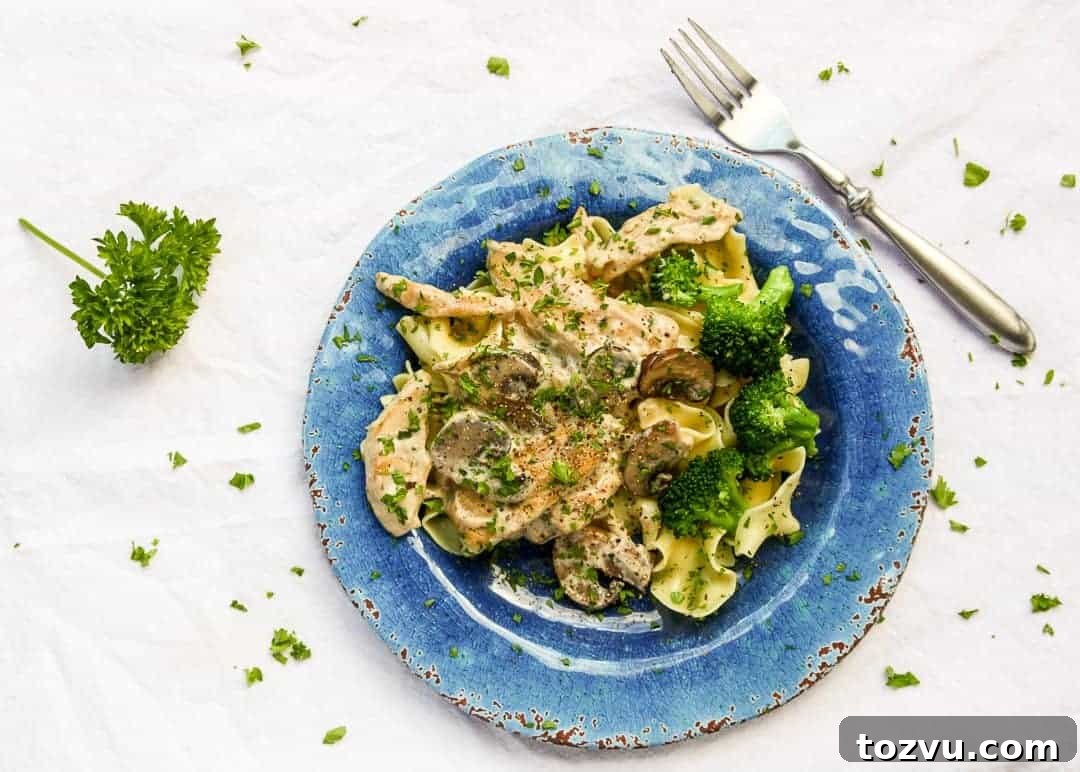 A plate of pasta with broccoli