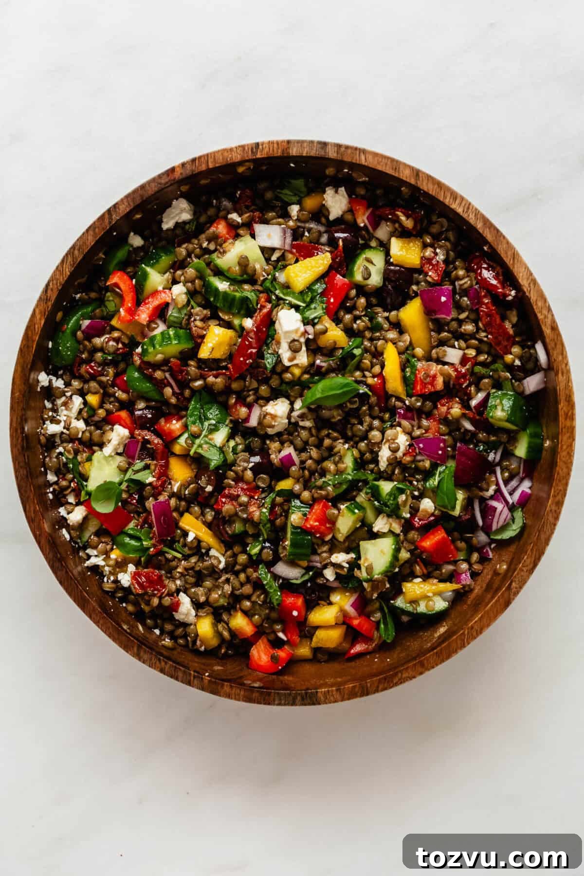 Zesty Mediterranean Lentil Salad with Feta and Fresh Herbs 5 Mediterranean lentil salad in a wood bowl.