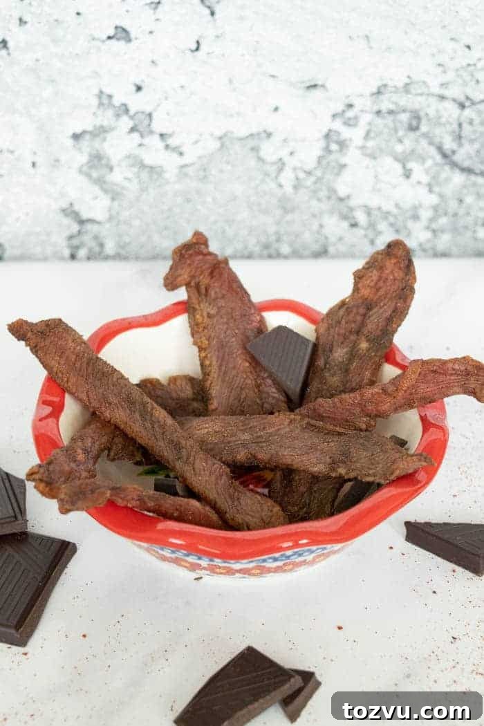 Mole-Spiced Turkey Jerky Recipe 2 Mole turkey jerky in bowl with chocolate