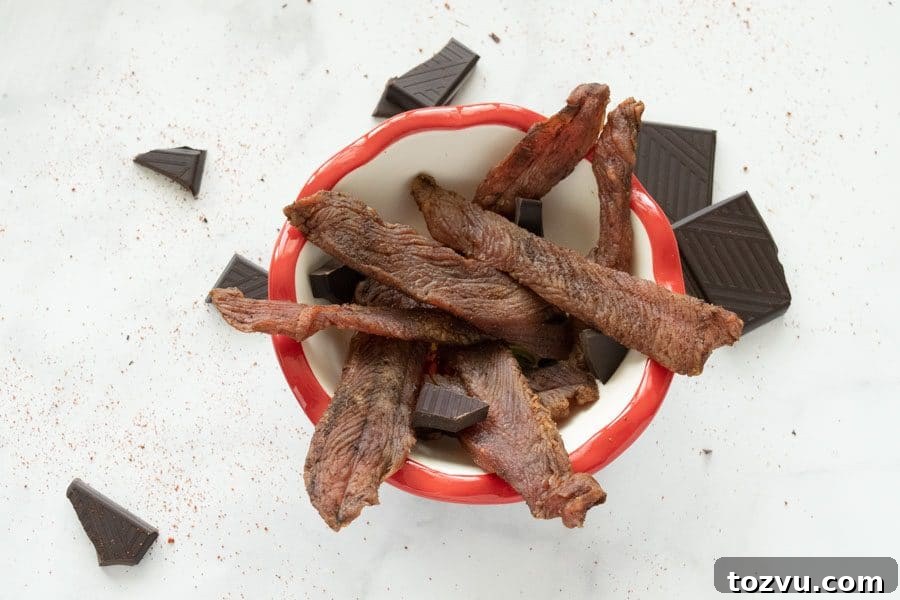 Mole-Spiced Turkey Jerky Recipe 11 Mole turkey jerky in bowl with chocolate