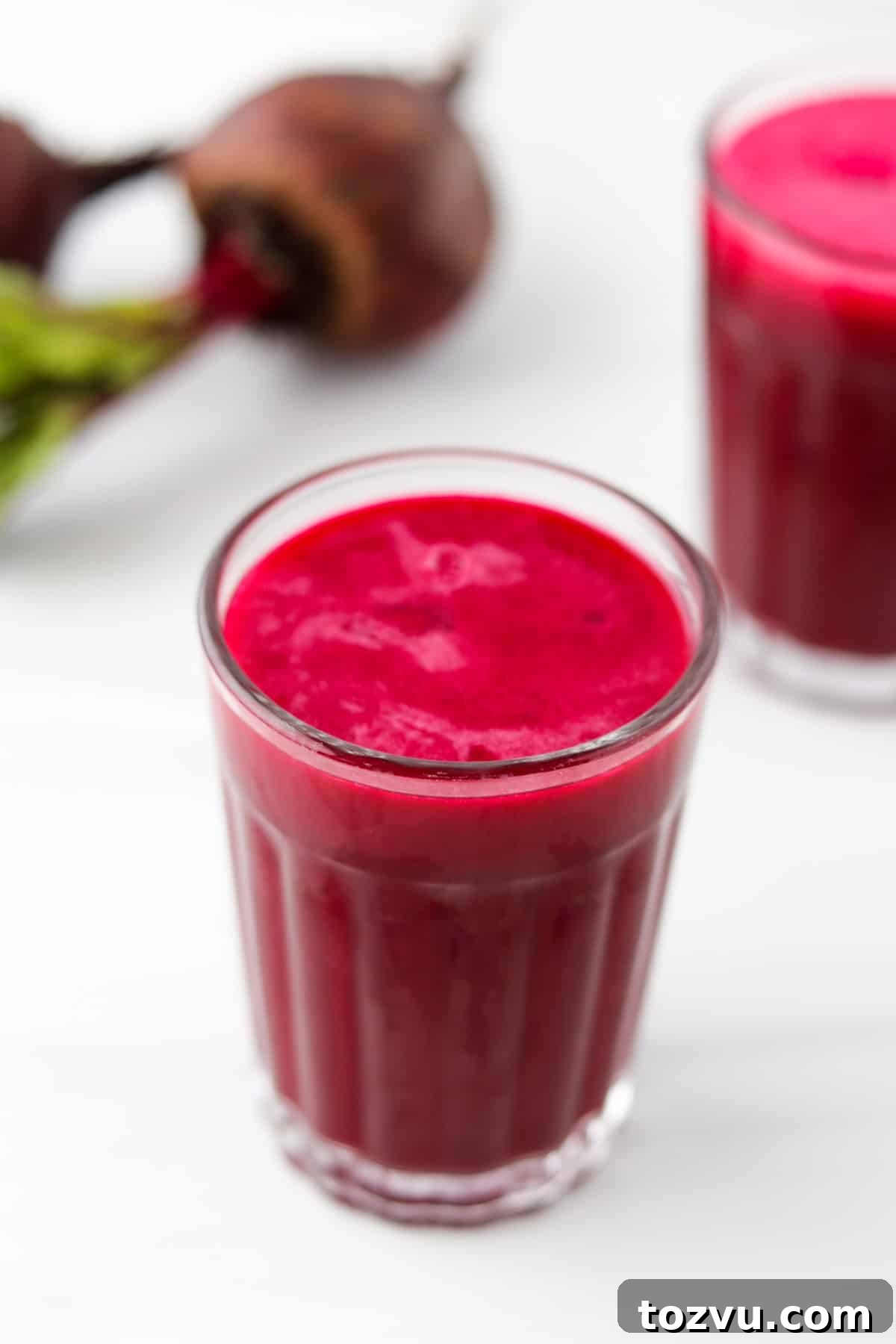 Blender Beet Juice Recipe: Quick Homemade Beet Juice 2 Glass of beet juice next to beets.