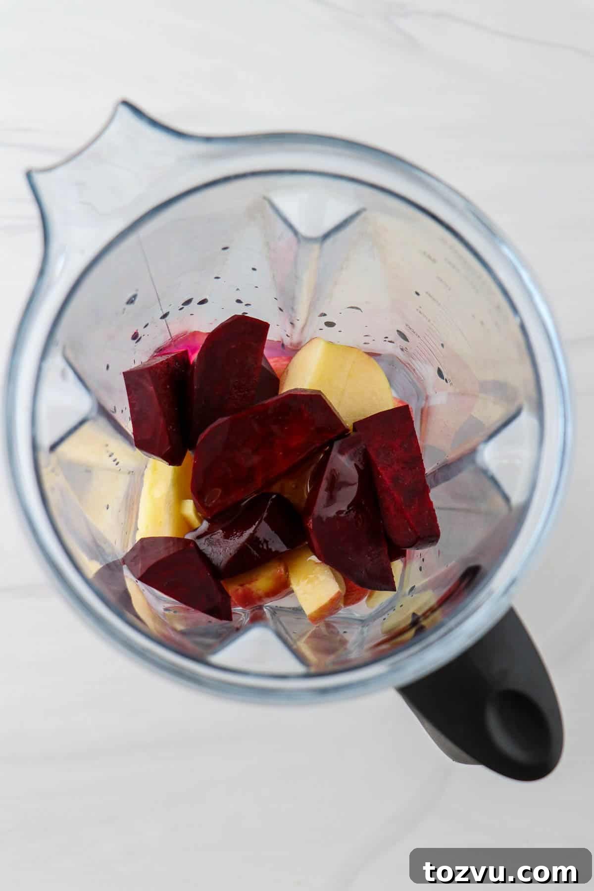 Blender Beet Juice Recipe: Quick Homemade Beet Juice 4 Chopped beets and apples in a blender.