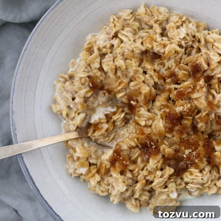 Oatmeal in a bowl with a spoon on a napkin
