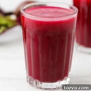 Close up of a glass of beet juice.