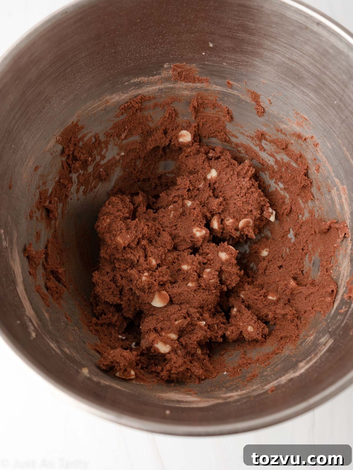 Red velvet chocolate chip cookie dough in a bowl.