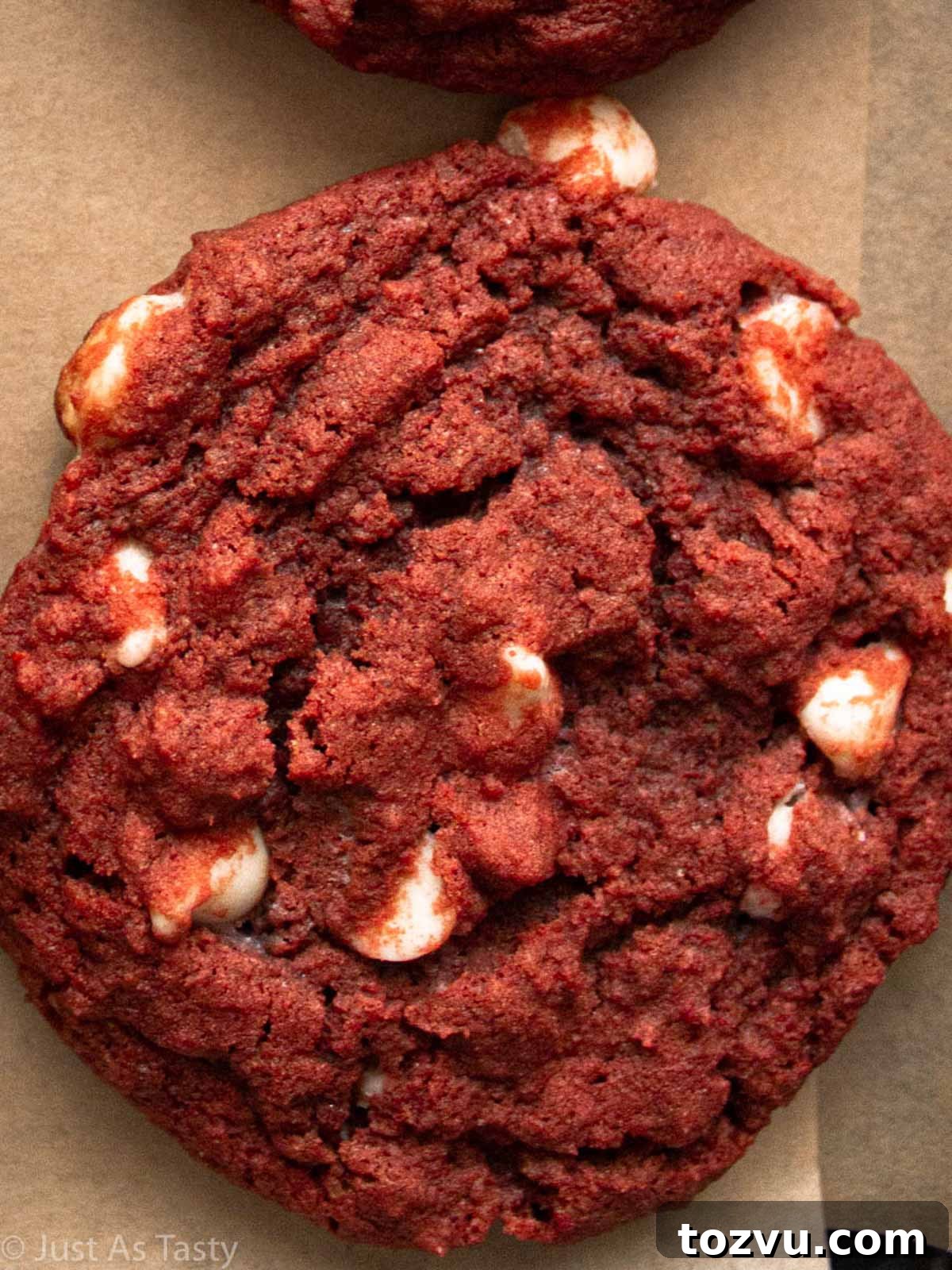 Close-up of a red velvet chocolate chip cookie.