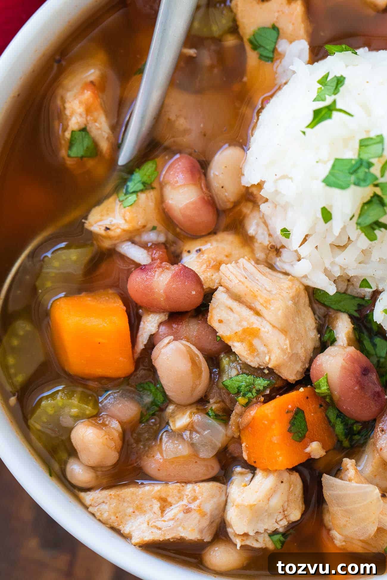 Cajun 15-Bean Turkey Soup 2 close up shot of cajun 15 bean soup in a bowl with rice
