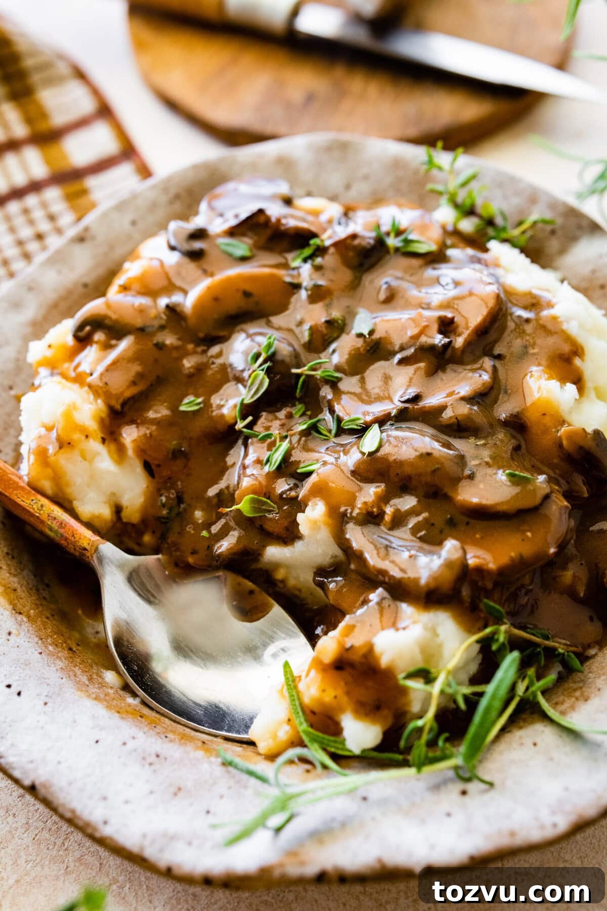 How to Make Mushroom Gravy from Scratch 3 Easy mushroom gravy served over mashed potatoes with herbs.