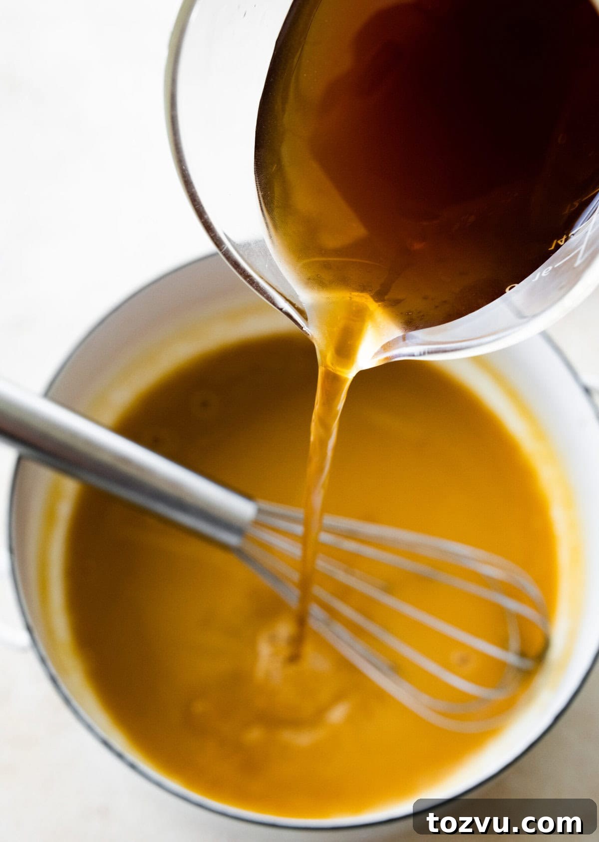 How to Make Mushroom Gravy from Scratch 10 Pour the broth into the pot.