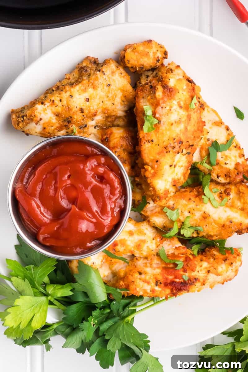 Crispy Air Fryer Chicken Tenders Without Breading 6 Chicken tenders with dipping sauce.