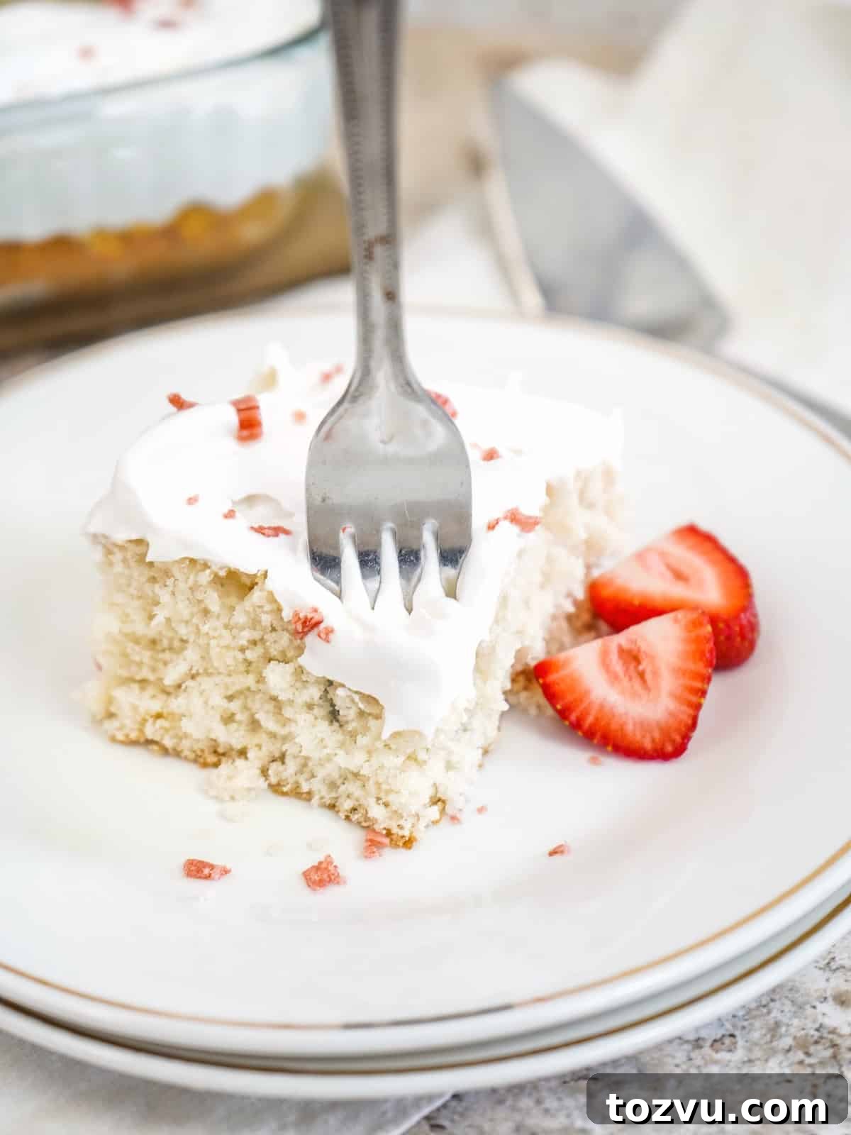 3-Ingredient Cream Soda Cake 2 fork in cream soda cake on white plate