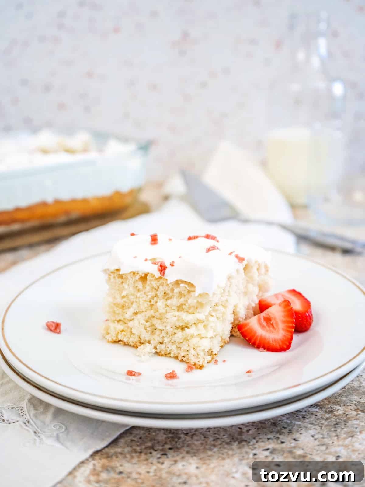 3-Ingredient Cream Soda Cake 9 slice of cream soda cake on a white plate