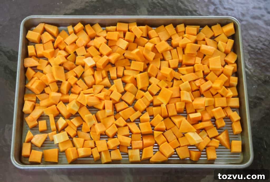 Season cubed butternut squash before roasting