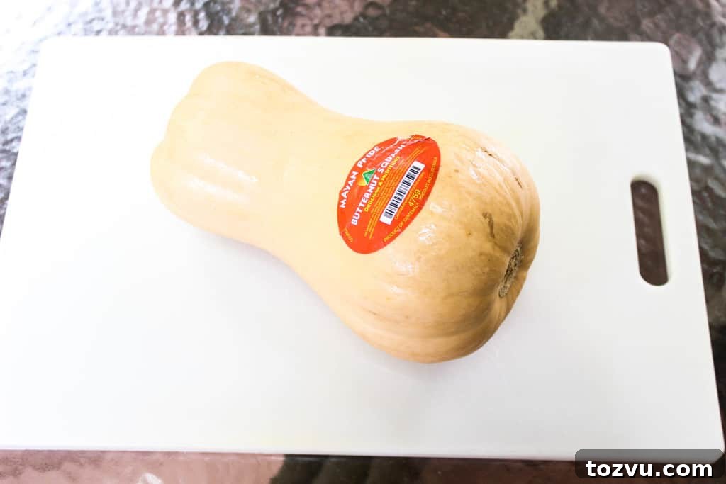 Large butternut squash on cutting board