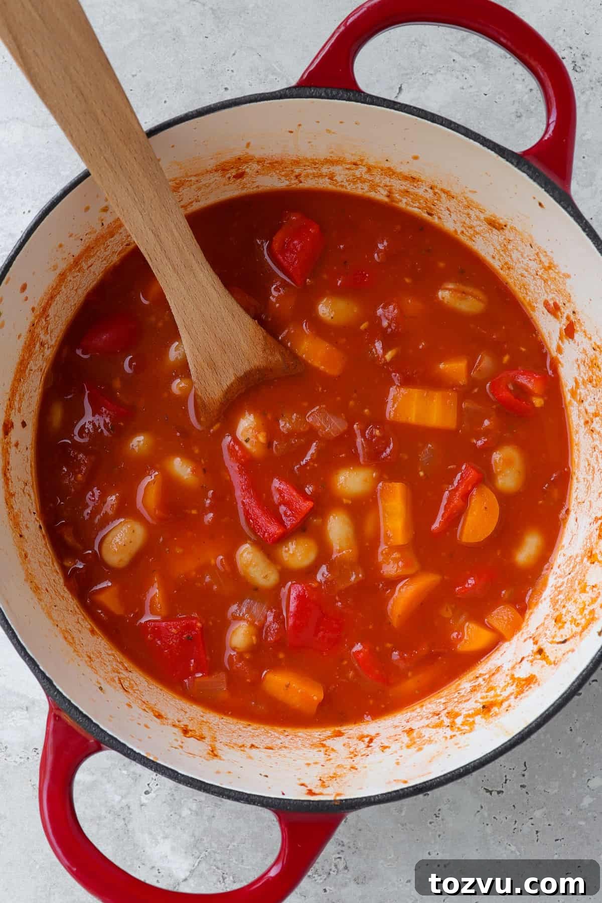 Cooked tomato soup in a pot before being blended.