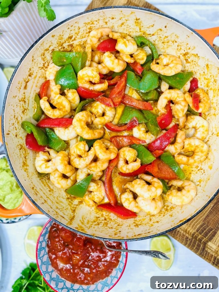 20-Minute Shrimp Fajitas with Peppers and Lime 7 prawn fajita filling cooked in a skillet pan