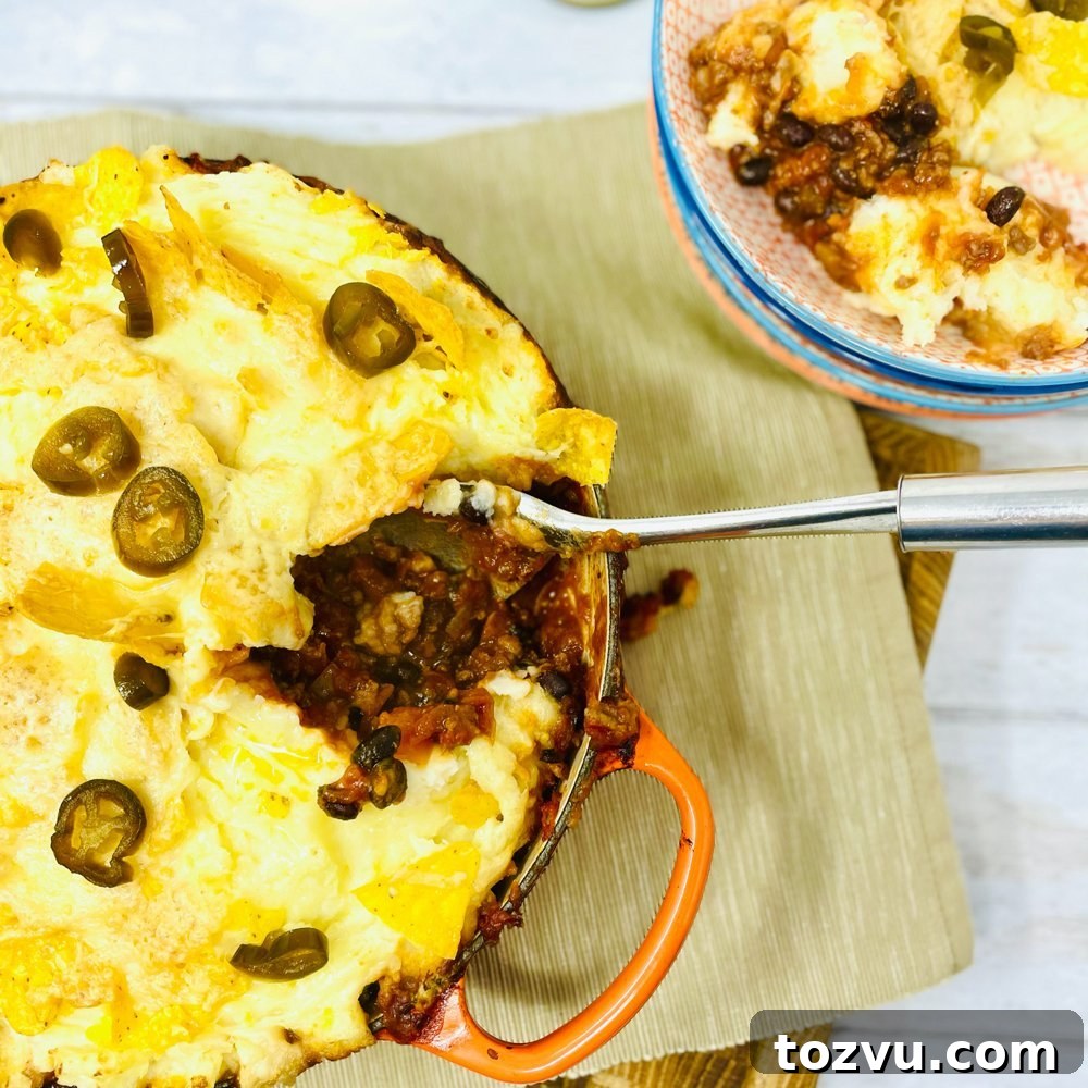 20-Minute Shrimp Fajitas with Peppers and Lime 10 Mexican cottage pie with cheesy nacho mashed potatoes being spooned out of the dish