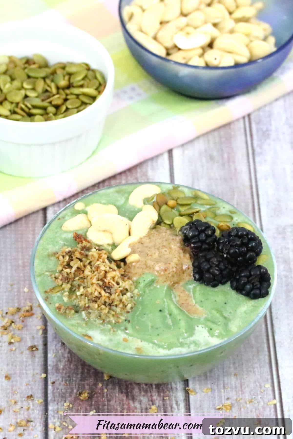 18 Toppings for Smoothie Bowls That Add Flavor and Texture 3 green smoothie bowl with nuts, seeds and berries on top and more topping ingredients behind it in bowls