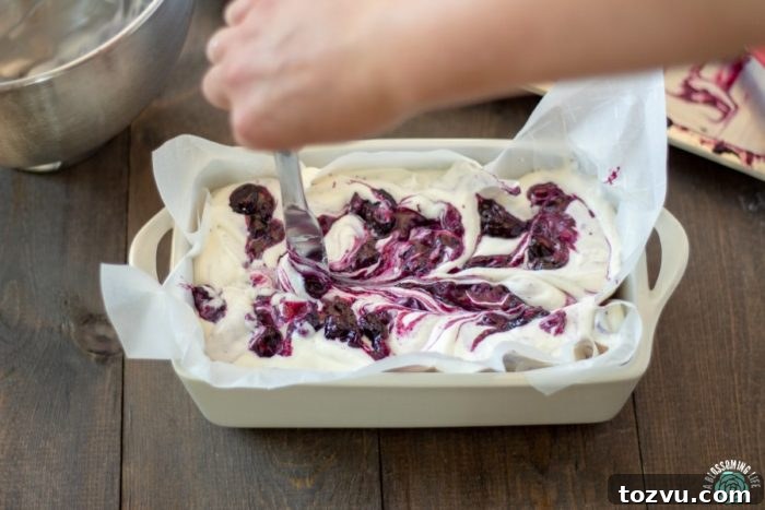No-Churn Lemon Blueberry Cheesecake Ice Cream Sandwiches 4 Mixing blueberry sauce and ice cream base