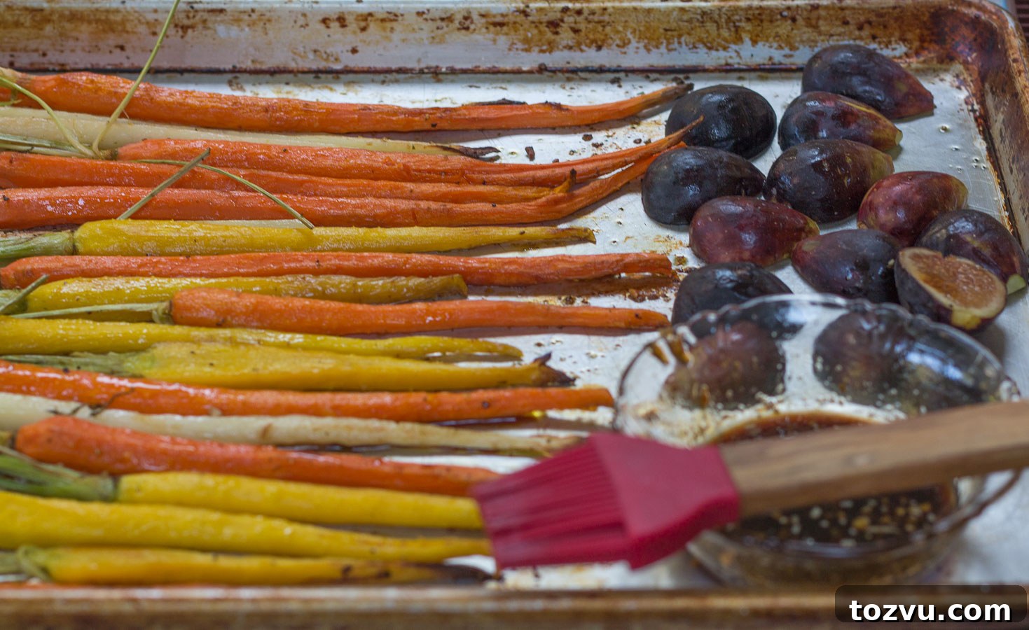 Brushing glaze on carrots and figs