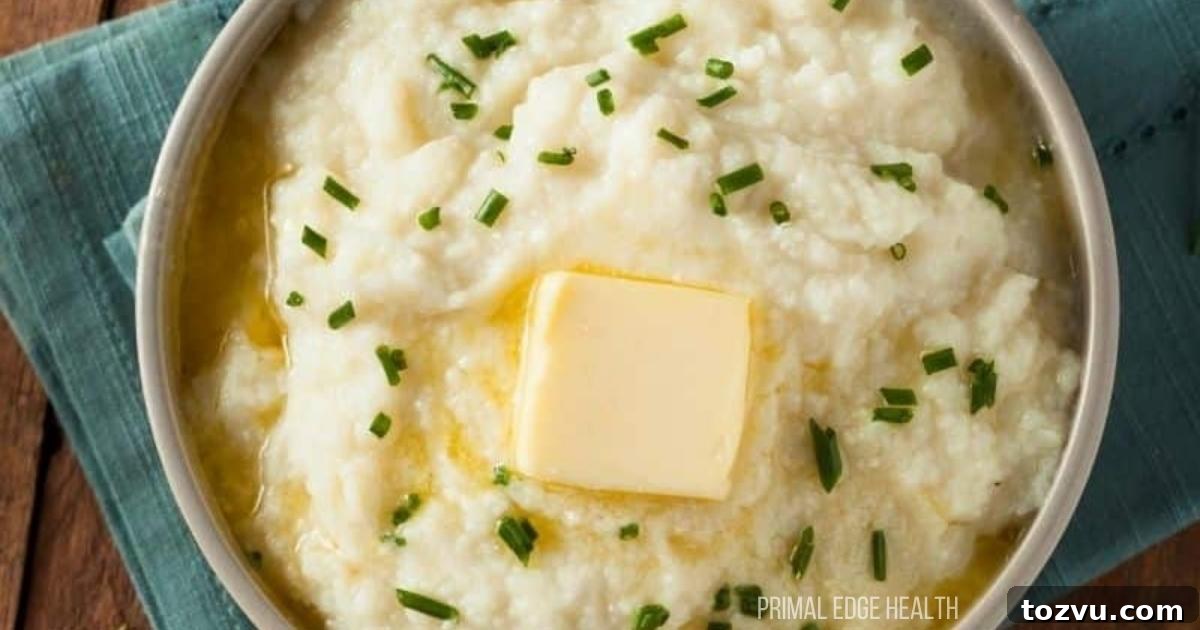 17 Thanksgiving Recipes Ready in Minutes 3 Mashed cauliflower potatoes with butter on top in a bowl.