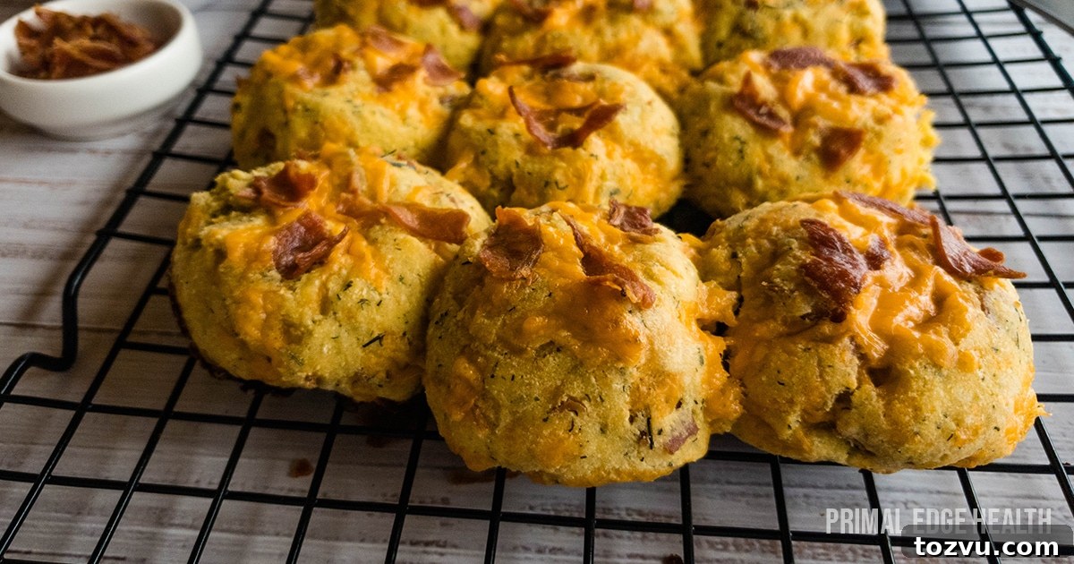17 Thanksgiving Recipes Ready in Minutes 4 A picture of biscuits with bacon and cheese on top cooling on rack.