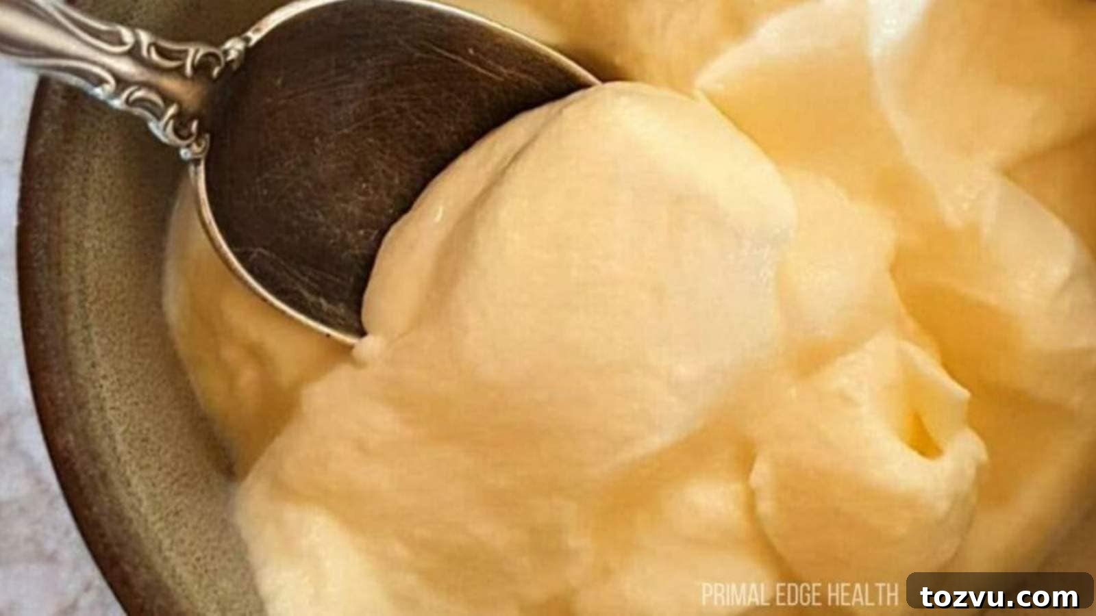 17 Thanksgiving Recipes Ready in Minutes 6 A spoon dipping into a bowl of cheesecake fluff.
