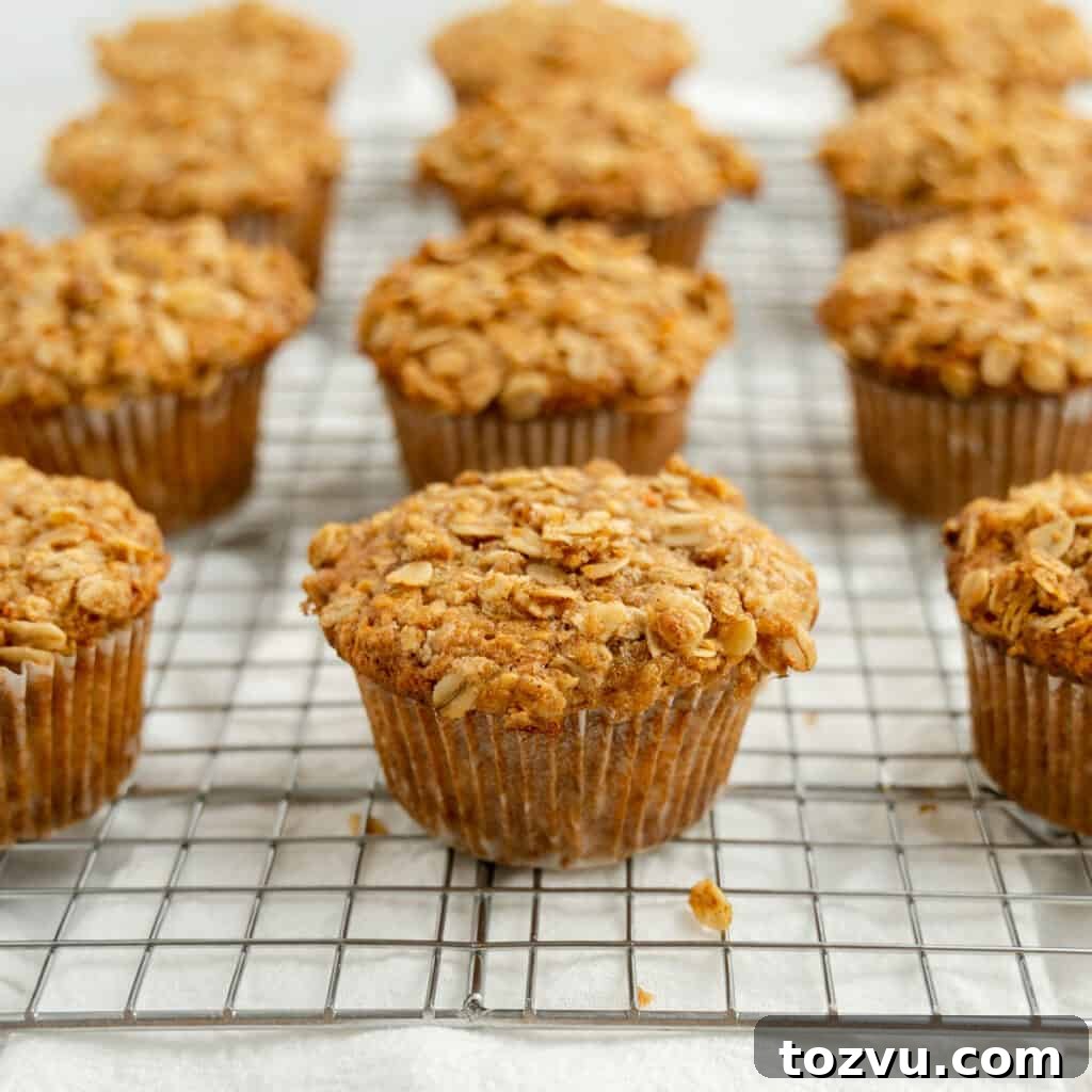 Carrot Apple Muffins on a wire rack.