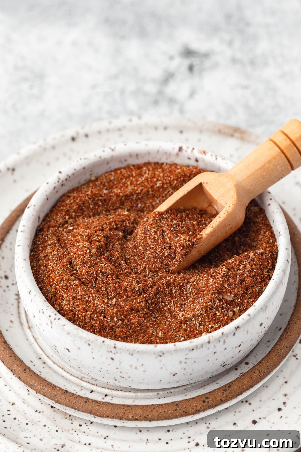 Homemade Chicken Taco Seasoning Mix 2 Homemade chicken taco seasoning in a small speckled white bowl.