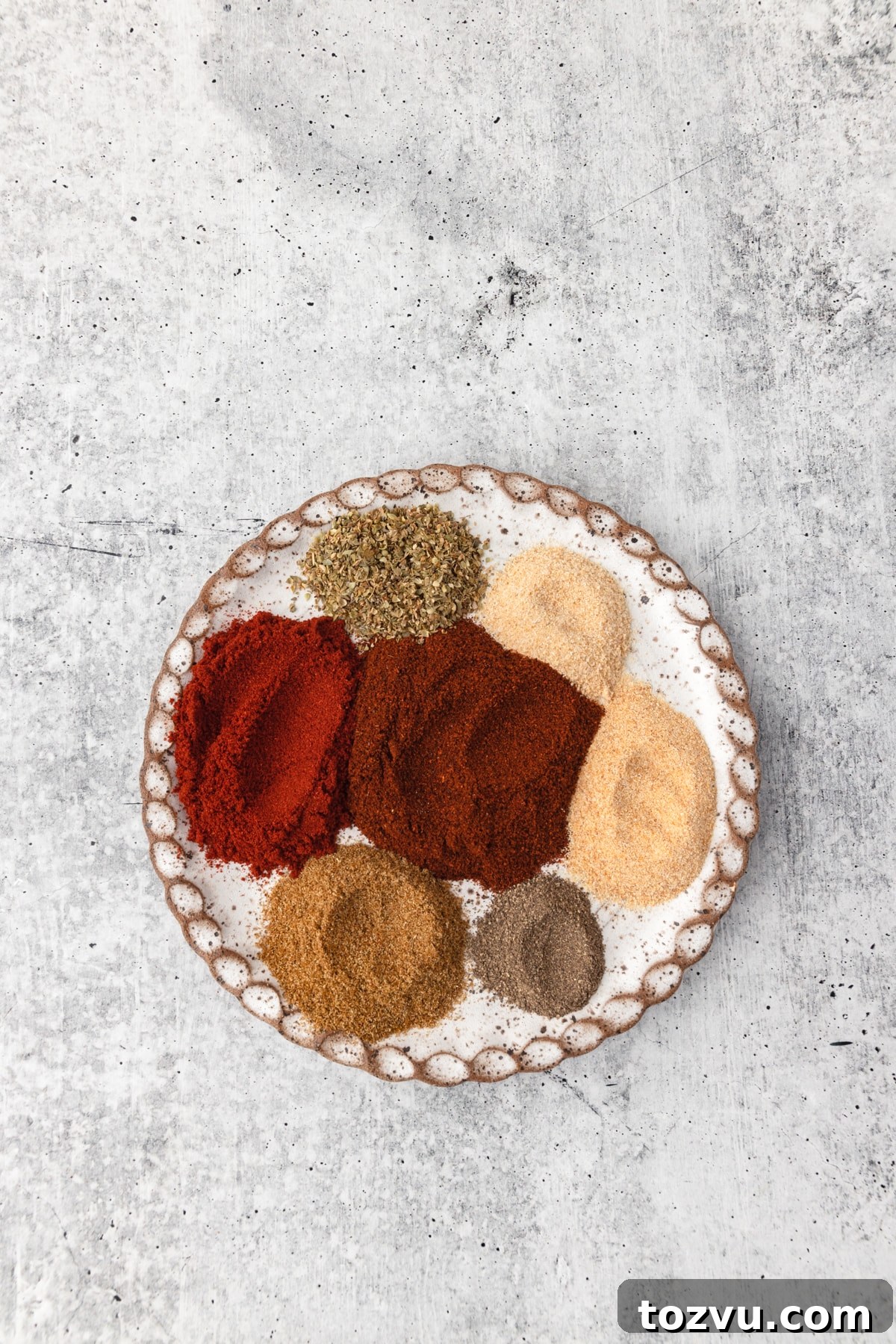 Homemade Chicken Taco Seasoning Mix 4 Chicken Taco Seasonings on a small plate.
