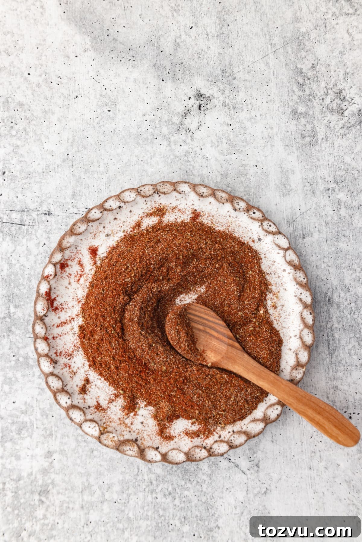 Homemade Chicken Taco Seasoning Mix 5 Chicken Taco Seasoning mixed on a plate with a small spoon.