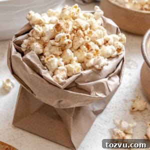 Completed Chai Popcorn in a bowl against a white surface.