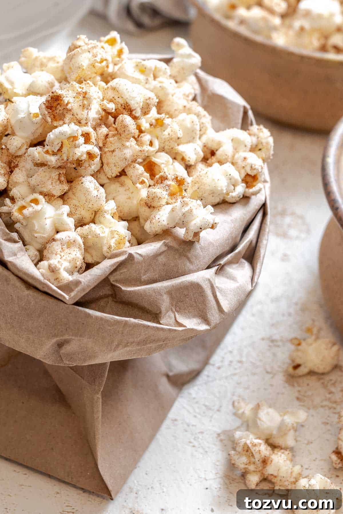 Completed Chai Popcorn in a bowl against a white surface.