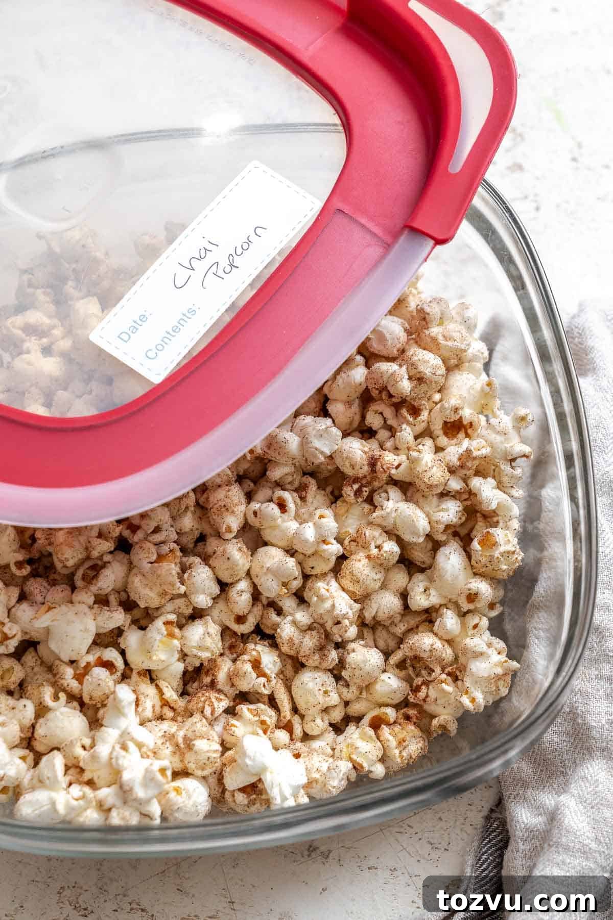 Completed Chai Popcorn in a storage container.