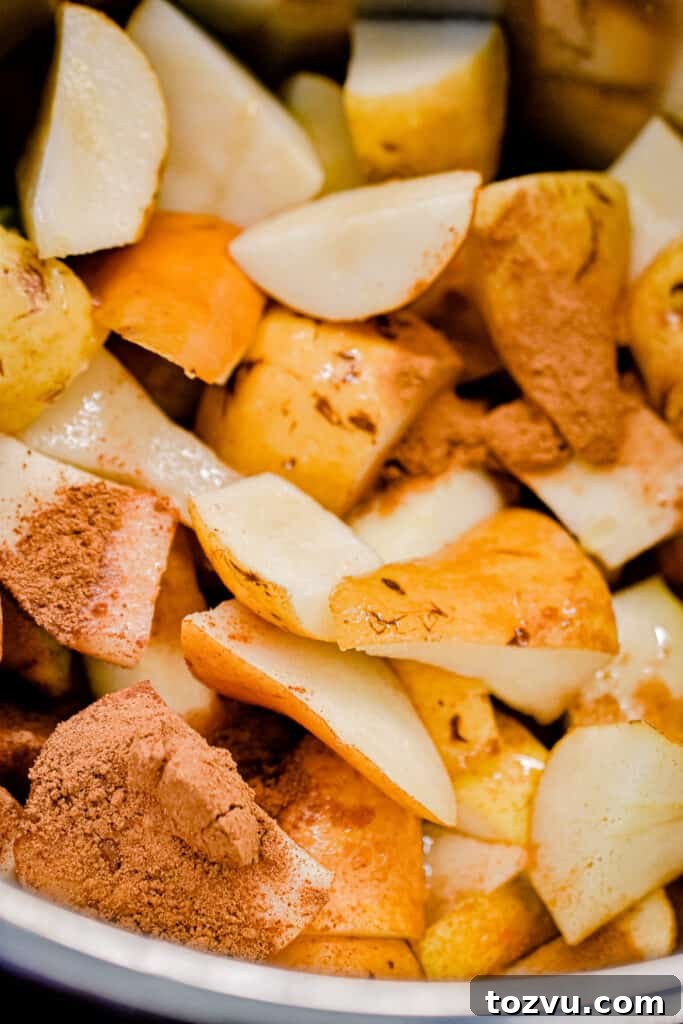 Quick Instant Pot Pear Butter Recipe 6 The ground spices are added to the pears.