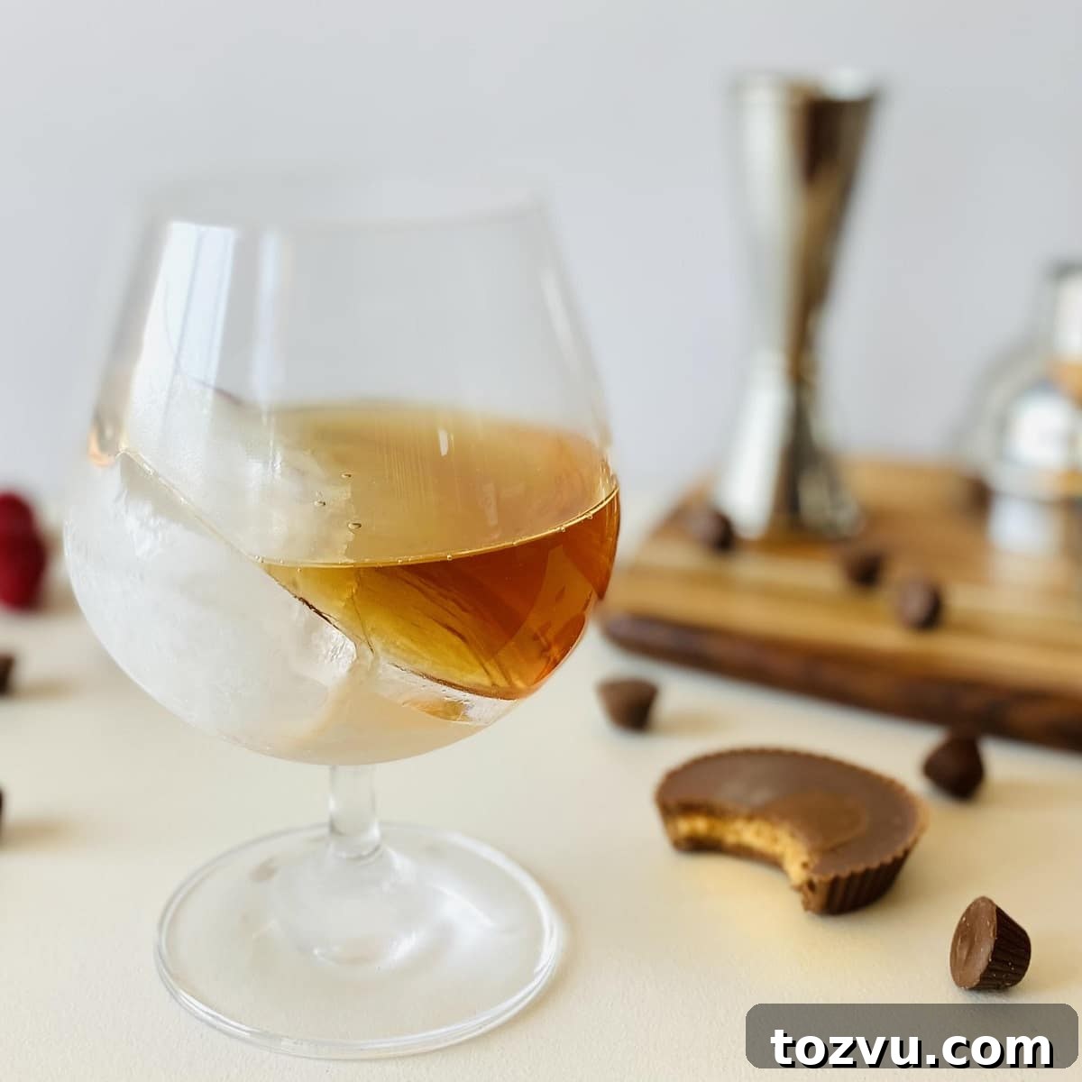 Peanut Butter Whiskey: Brands, Recipes & Cocktail Ideas 10 skrewball peanut butter whiskey with peanut butter cups around